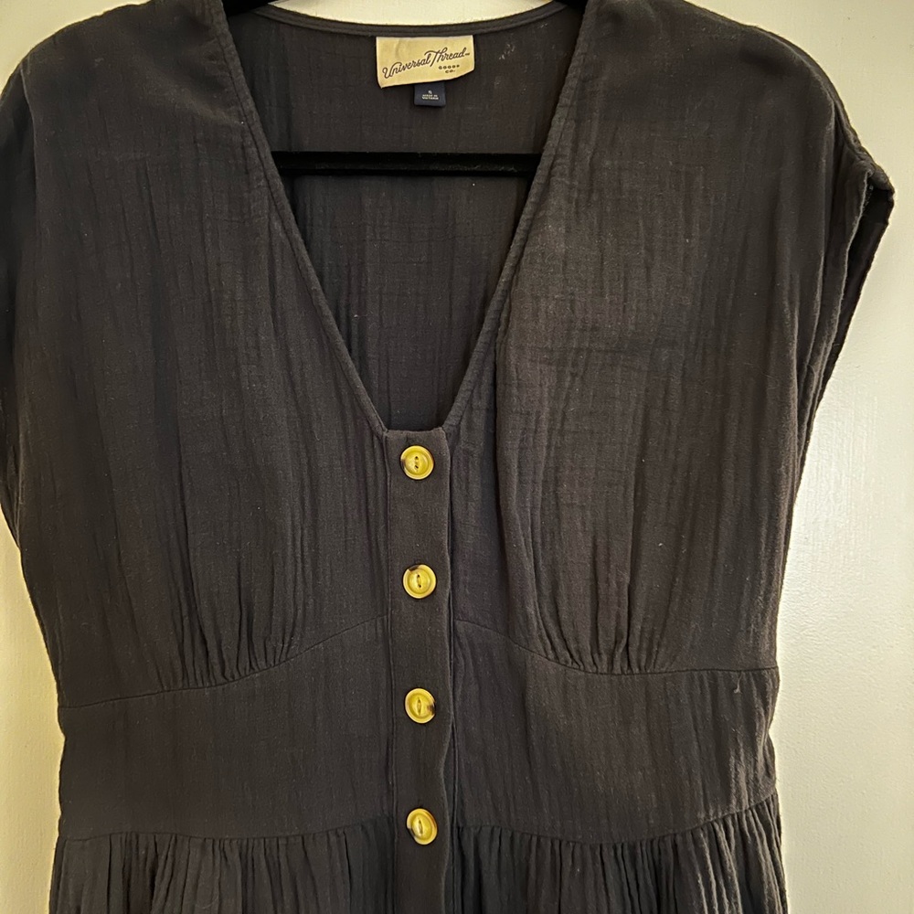 Romper, lightweight soft material. Navy almost looks black.